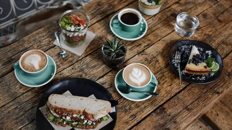 coffee and sandwiches on table
